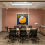 Dunedin City Hall-23 Orange Blossom Conference Room at The ProMedia Group office with a large logo on the wall.
